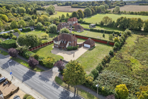 Aerial drone view of property and surrounding area