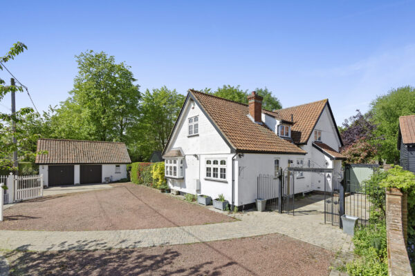 Real estate photo of family home with garage fronta