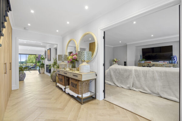 Hallway with open sightline to swimming pool area